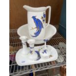 A LARGE WASH JUG AND BOWL AND A FURTHER DRESSING TABLE SET WITH BIRD DESIGN
