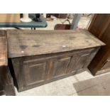 A GEORGE III OAK BLANKET CHEST (REQUIRES HINGES RE-AFFIXING)
