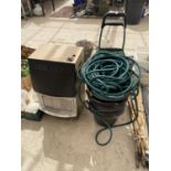 A SHOOPING TROLLEY, A HOSE PIPE AND A QUANTITY OF BUCKETS ETC