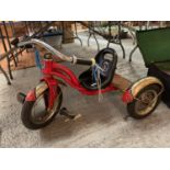 A RED VINTAGE STYLE CHILDS TRIKE
