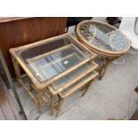 A BAMBOO NEST OF THREE TABLES WITH GLASS TOP AND BAMBOO COFFEE TABLE