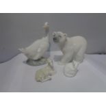 FOUR EXAMPLES OF CERAMIC ANIMALS TO INCLUDE A NAO DUCK, A LLADRO POLAR BEAR AND LAMB