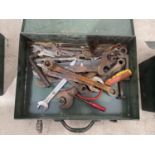 A METAL TOOL BOX AND AN ASSORTMENT OF SPANNERS