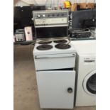 A WHITE FREESTANDING BELLING OVEN AND HOB