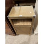 A LLOYD LOOM STYLE BEDSIDE CABINET