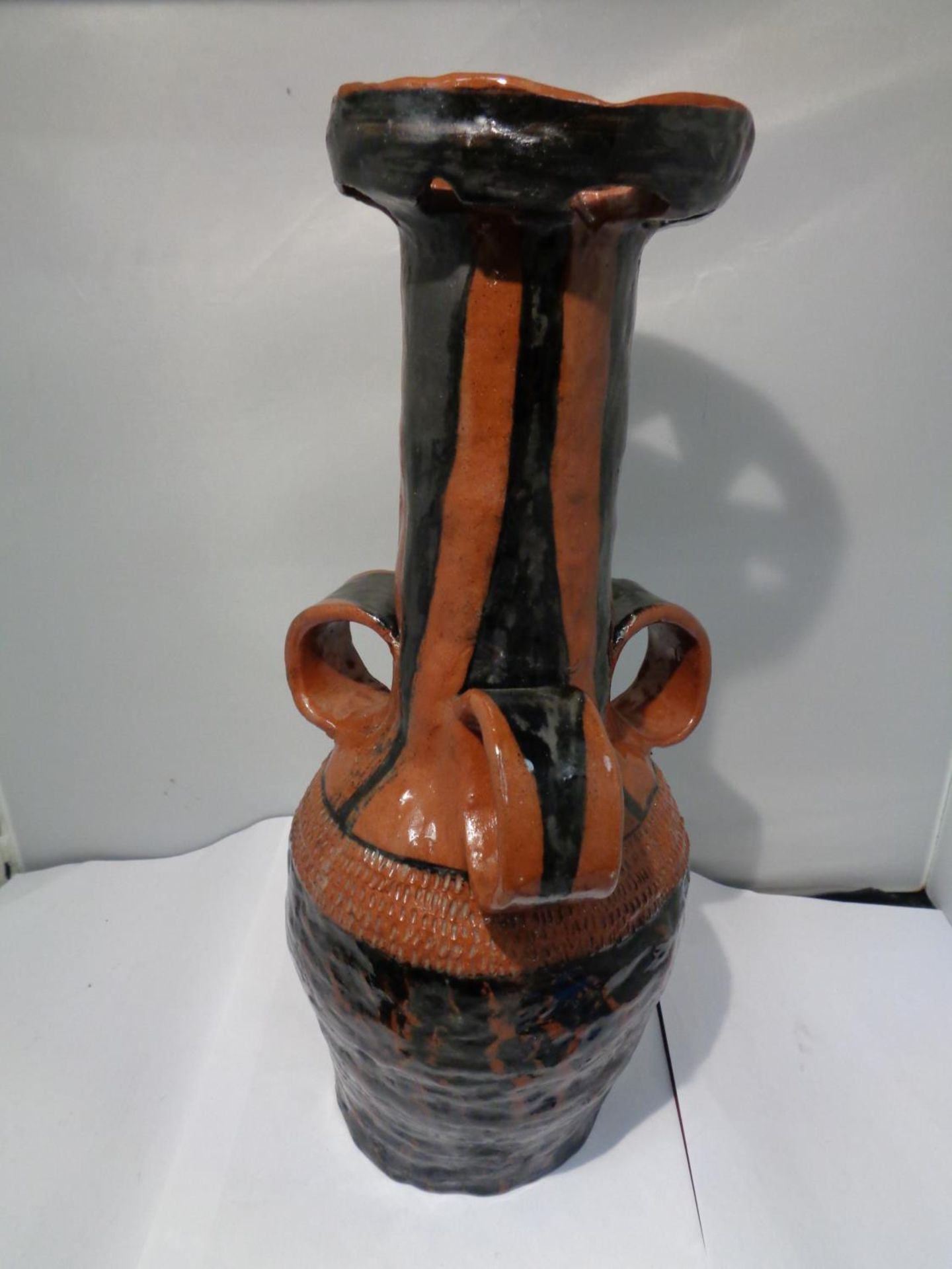 A LARGE MIDDLE EASTERN, POSSIBLY TURKISH, POTTERY TRI HANDLDED WINE VESSEL, HEIGHT 39 CM - Image 2 of 2