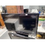 A 37" LG TELEVSION WITH REMOTE CONTROL