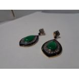 A PAIR OF JADE ON BLACK ONYX EARRINGS WITH DIAMOND SURROUND AND YELLOW AND WHITE METAL