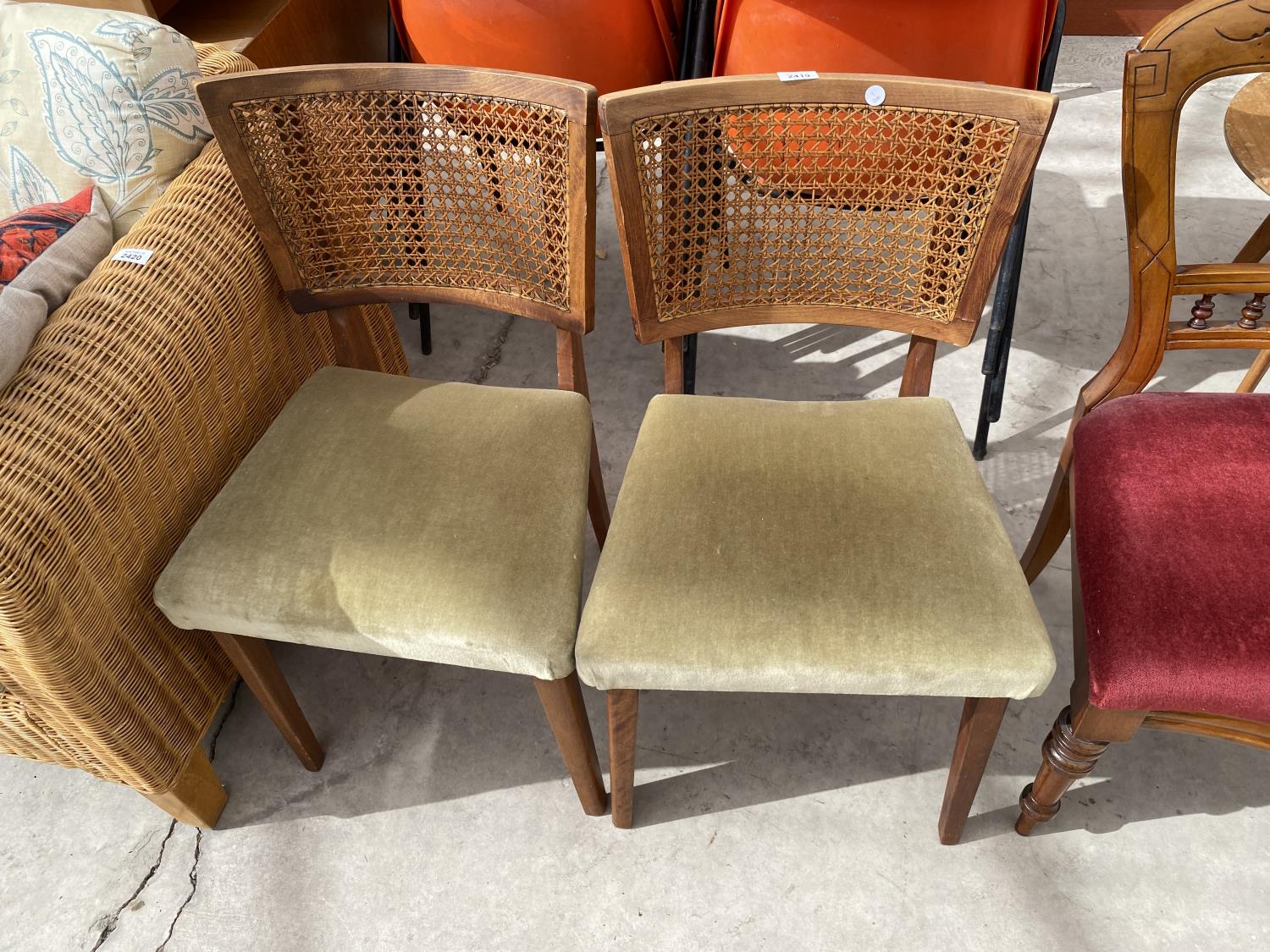 A PAIR OF RETRO TEAK POSSIBLY DANISH DESIGN DINING CHAIRS WITH SPLIT CANE BACKS