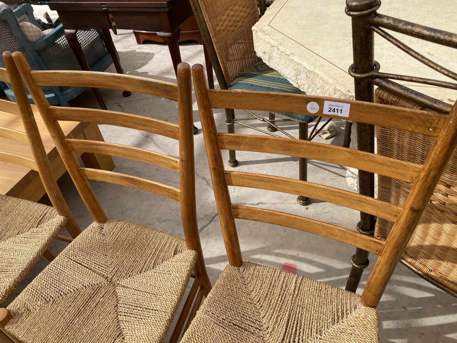 A SET OF THREE RETRO BEECH RATTAN SEATED CHAIRS WITH LADDERBACKS - Image 2 of 4