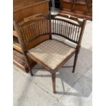 AN EDWARDIAN BEECH CORNER CHAIR WITH TURNED BACK SPINDLE