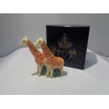 A BOXED ROYAL CROWN DERBY GIRAFFES