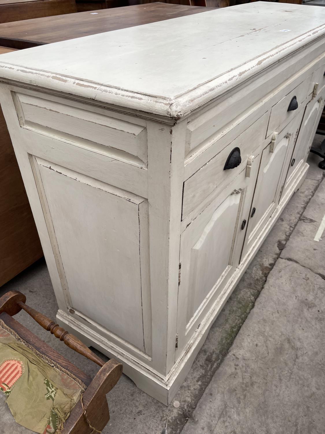 A PAINTED HARDWOOD VICTORIAN STYLE SIDEBOARD, 57" WIDE, ENCLOSING THREE PANELLED DOORS AND THREE - Image 3 of 5