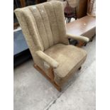 A MID 20TH CENTURY UPHOLSTERED ROCKING CHAIR