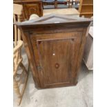 A GEORGE III OAK AND MAHOGANY INLAID CORNER CUPBOARD