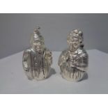 A PAIR OF SILVER PLATED CRUETS IN THE DESIGN OF PUNCH AND JUDY
