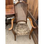 A MAHOGANY ARMCHAIR WITH RATTAN BACK