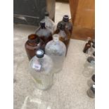 AN ASSORTMENT OF LARGE GLASS LAB BOTTLES
