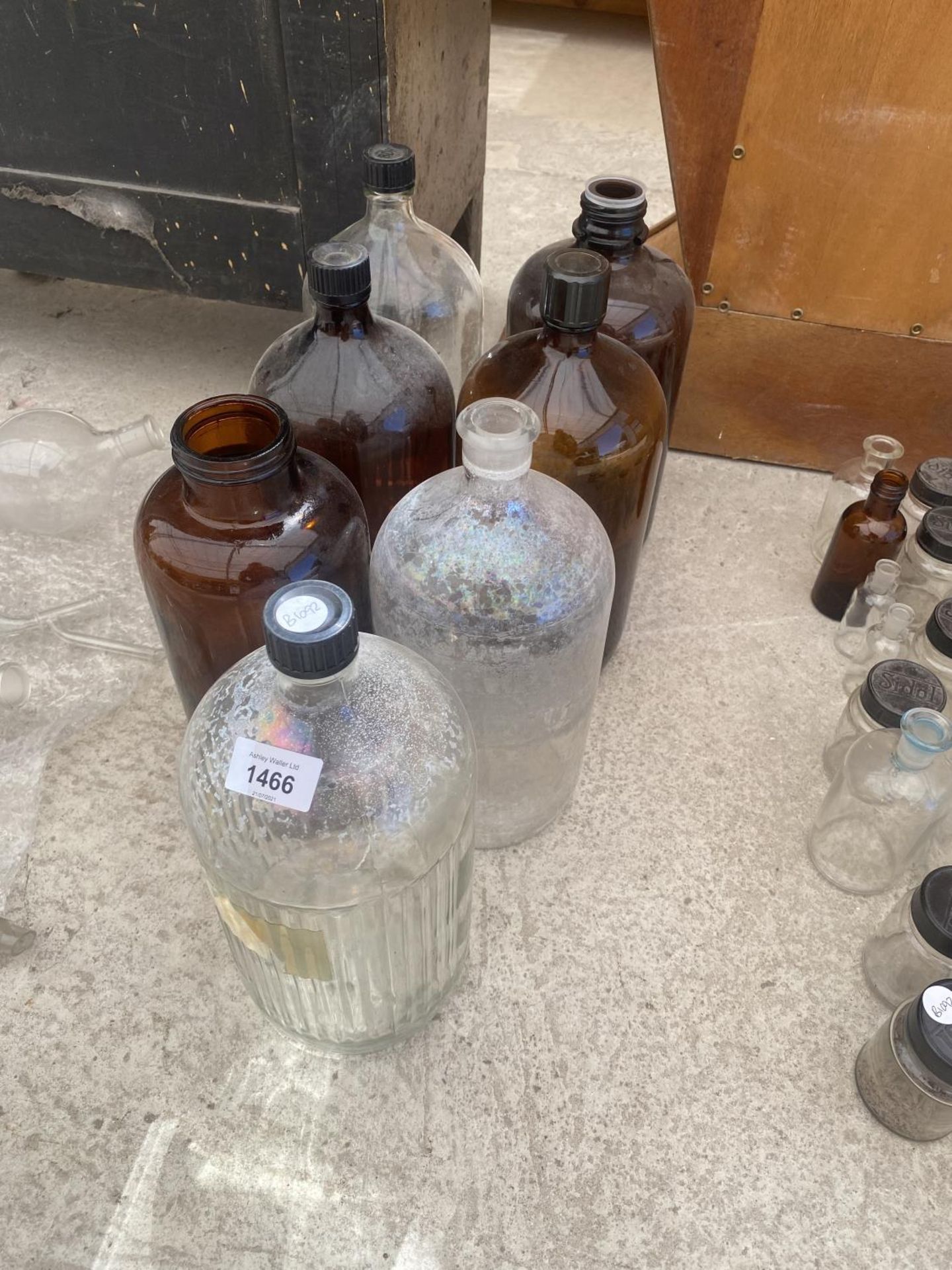 AN ASSORTMENT OF LARGE GLASS LAB BOTTLES