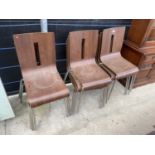 A SET OF TWELVE BENTWOOD STACKING CHAIRS ON TUBULAR CHROME BASES