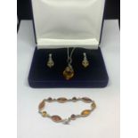 A SILVER AND AMBER SET TO INCLUDE A NECKLACE WITH PENDANT, EARRINGS AND A BRACELET IN A PRESENTATION