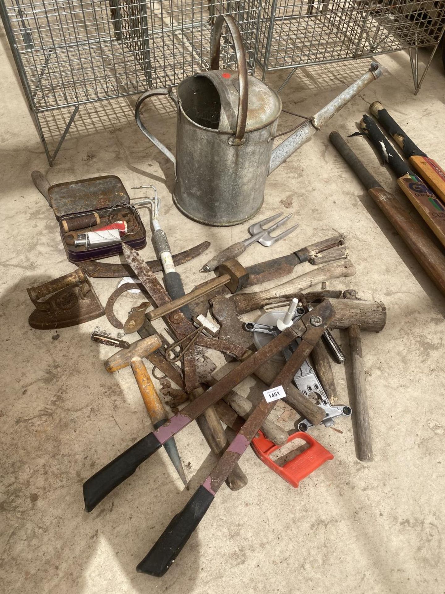 AN ASSORTMENT OF TOOLS TO INCLUDE A GALVANISED WATERING CAN, SHEARS AND AXE ETC