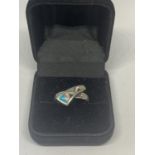 A SILVER RING WITH A NAVAJO STONE DESIGN IN A PRESENTATION BOX