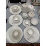 A COLLECTION OF WHITE CERAMICS TO INCLUDE A TEA POT AND A COFFEE POT