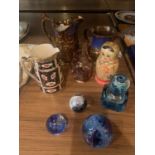 A MIXED SELECTION TO INCLUDE THREE DECORATIVE JUGS , THREE GLASS PAPER WEIGHTS VARIOUS THEMES