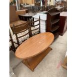 A RETRO TEAK EFFECT TWO TIER COFFEE TABLE WITH OVAL TOP, 47X23" AND A WATERFALL BOOKCASE WITH DRAWER