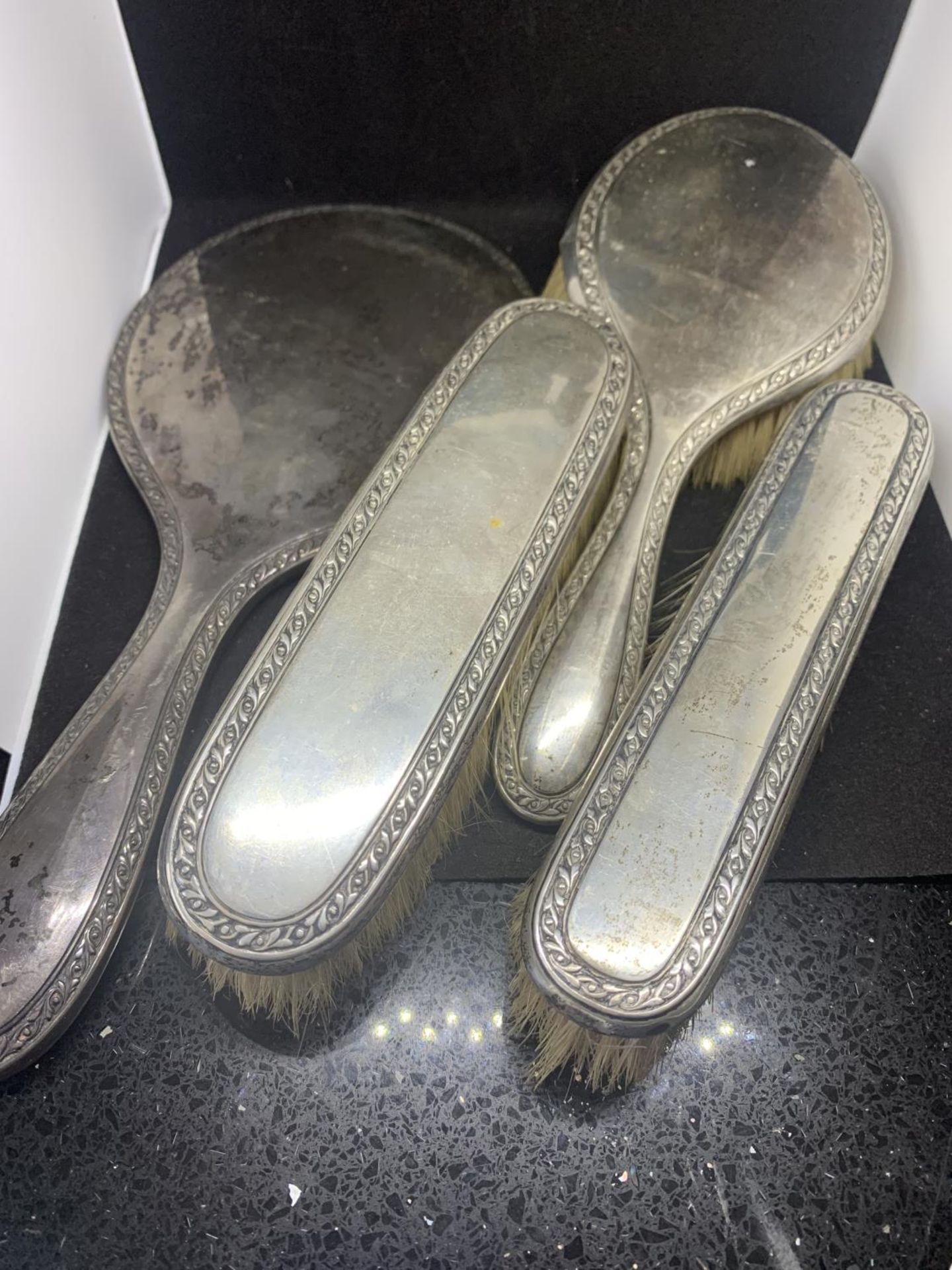 FOUR MARKED 830 SILVER BACKED ITEMS TO INCLUDE ONE MIRROR AND THREE BRUSHES