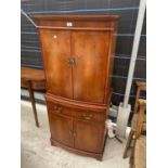 A YEW WOOD STRONGBOW FURNITURE COCKTAIL CABINET, HAVING MIRRORED UPPER PORTION, DRAWER, CUPBOARDS