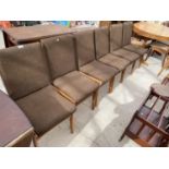A SET OF SIX RETRO DINING CHAIRS WITH UPHOLSTERED BACKS AND SEATS
