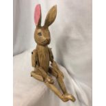 A WOODEN SHELF PUPPET RABBIT