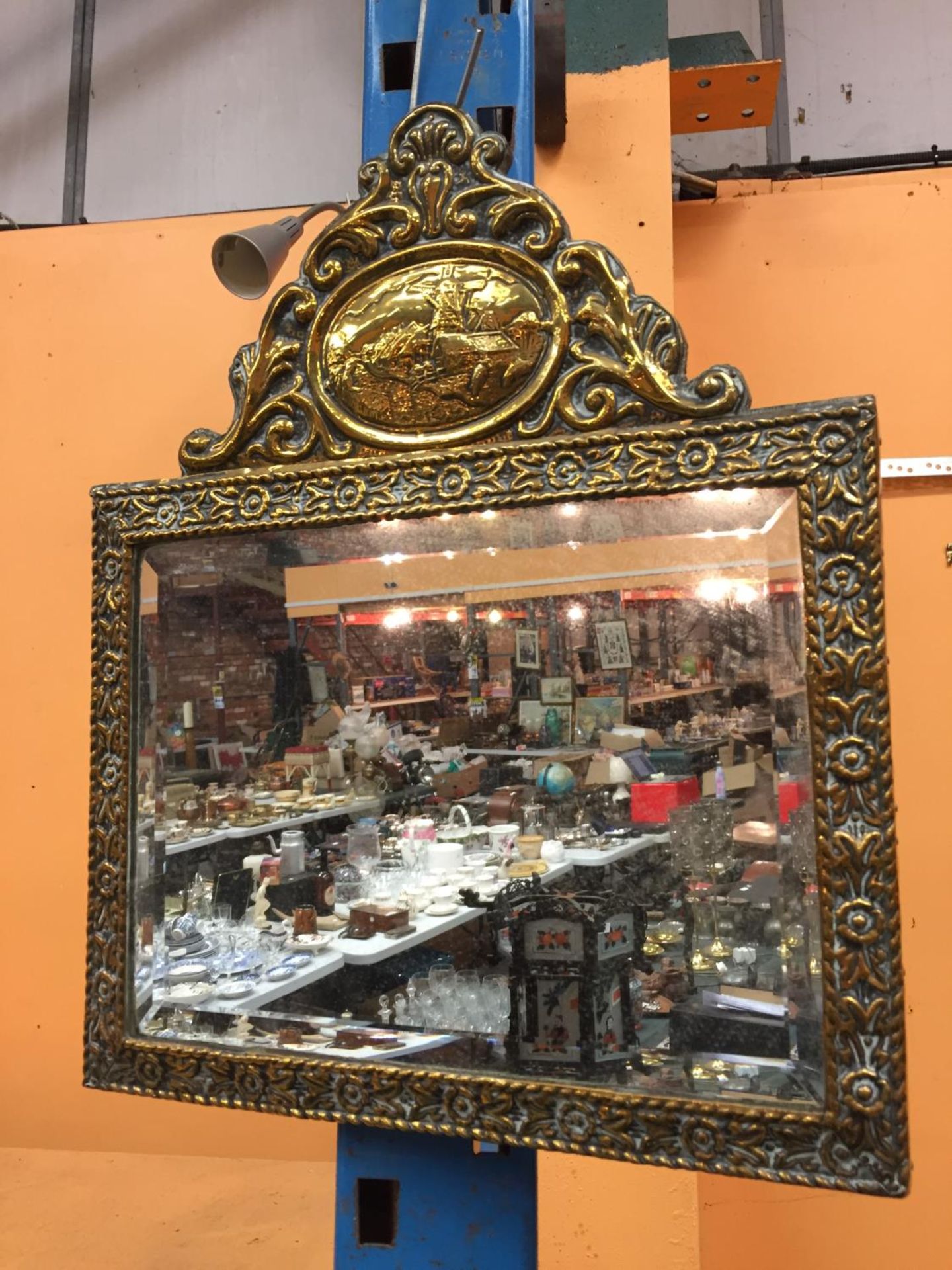 AN ORNATE FRAMED MIRROR 14" X 17"