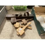 FOUR WOODEN MALLETS AND A LARGE WOOD PLANE