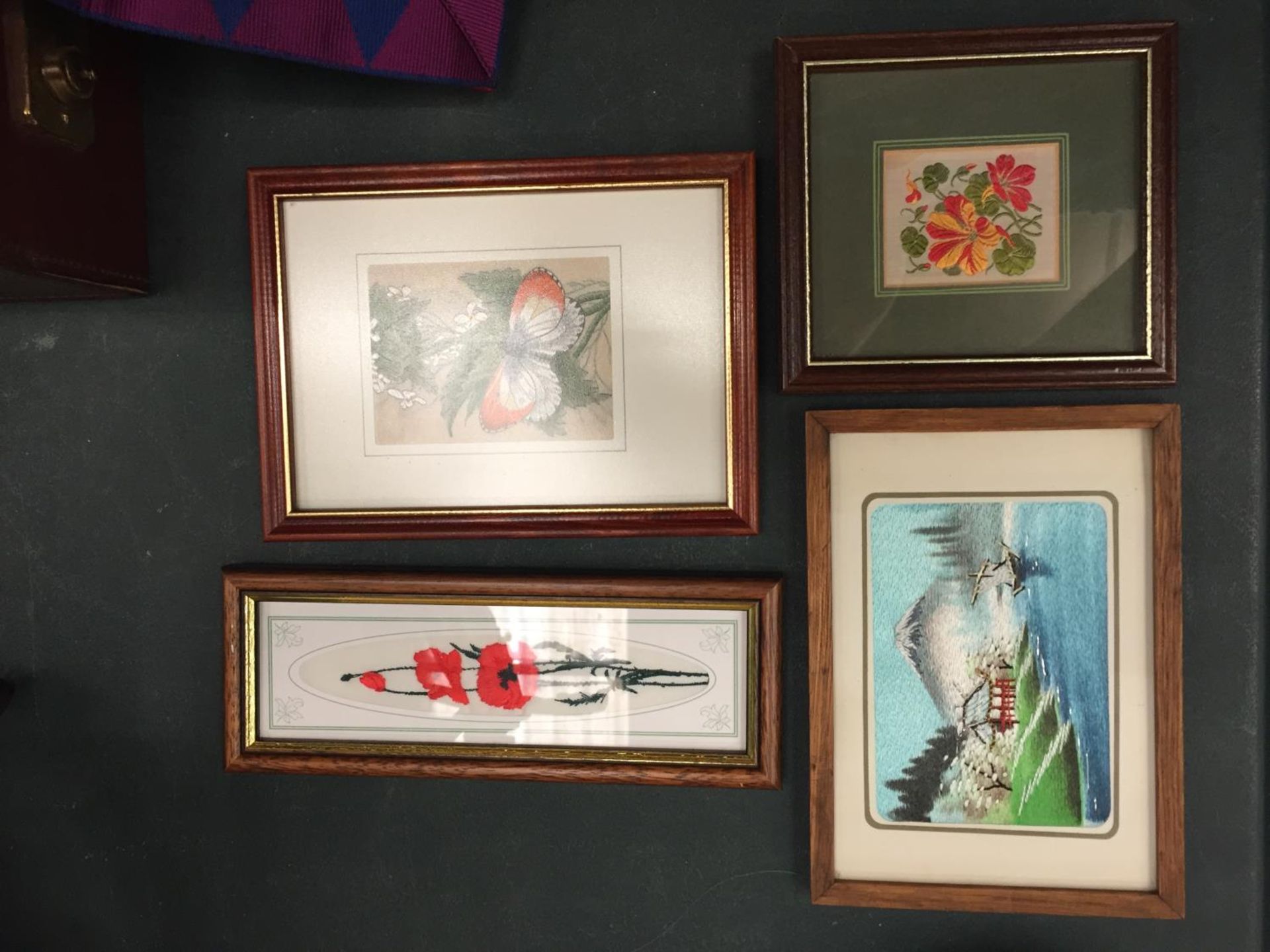 FOUR FRAMED SILK PRINTS