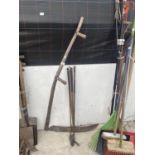 A VINTAGE WOODEN SCYTHE AND FIVE VINTAGE GOLF CLUBS