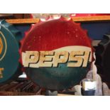 A BOTTLE CAP SHAPED SIGN - PEPSI