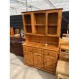 A MODERN PINE DRESSER WITH PARTIALLY GLAZED UPPER PORTION, 46" WIDE