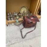 A VINTAGE LEATHER SATCHEL AND AN ASSORTMENT OF BRASS WARE TO INCLUDE BELLS AND CANDLESTICKS ETC