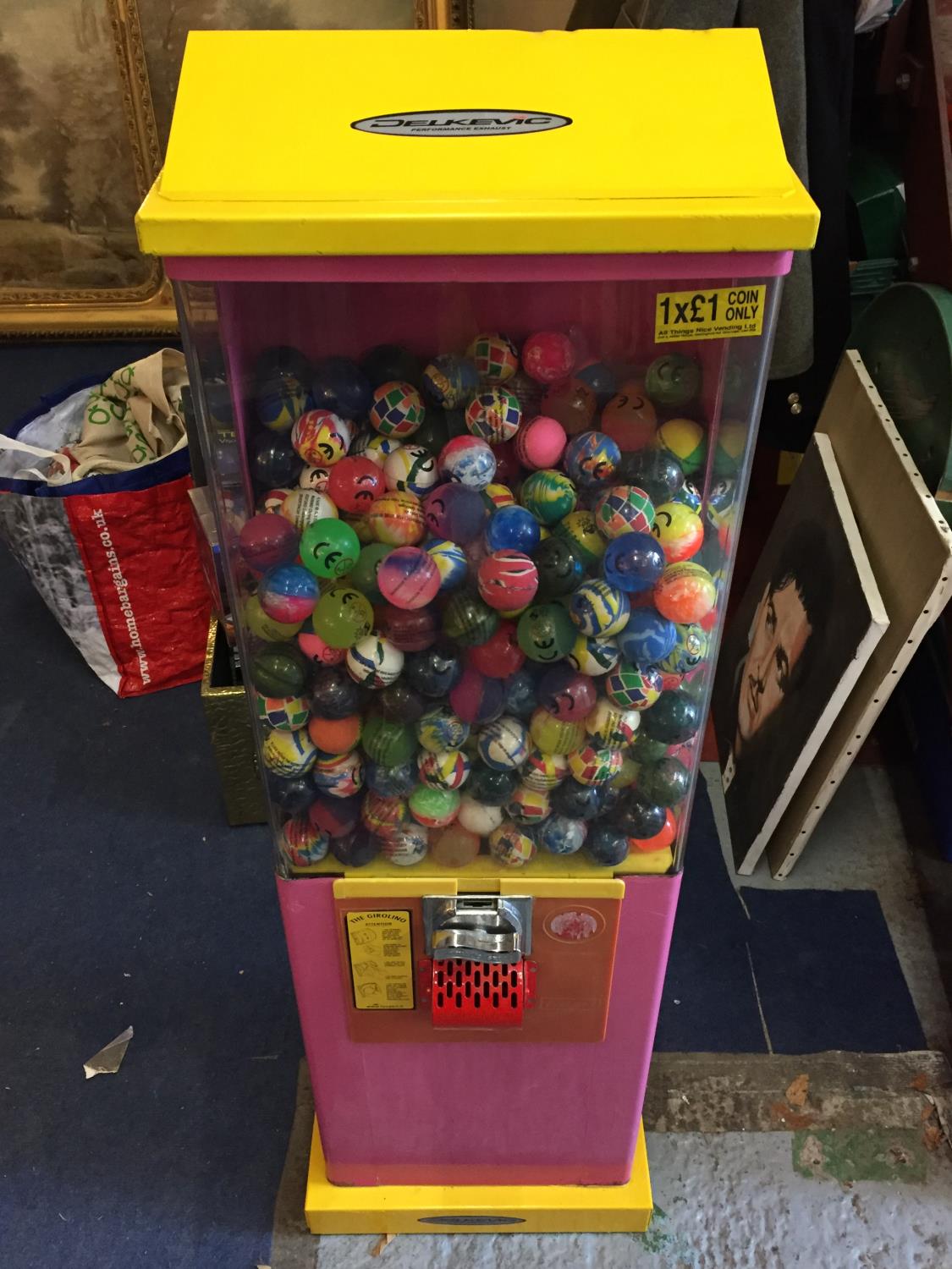 A CHILDRENS TOY BALL VENDING MACHINE WITH KEYS WITH OVER 400 BALLS