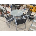 A GARDEN PATIO SET WITH ROUND GLASS TOP TABLE AND FOUR FOLDING CHAIRS