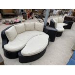 TWO RATTAN EFFECT PATIO SETTEES AND A POUFFE