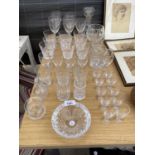 AN ASSORTMENT OF GLASS WARE TO INCLUDE A CUT DECANTOR, BRANDY GLASS, CUT WINE GLASSES ETC