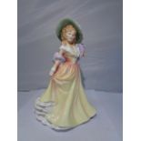 A ROYAL DOULTON FIGURINE KATIE