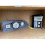 A VINTAGE CAR INSTRUMENT PANEL AND AN AVOMETER DA212