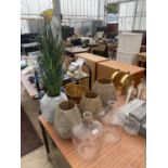 AN ASSORTMENT OF DECORATIVE PLANTERS AND VASES