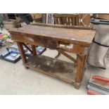 A VINTAGE WOODEN WORK BENCH