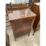 AN EDWARDIAN MAHOGANY AND INLAID TWO DOOR CABINET, 22" WIDE